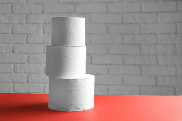 Rolls of toilet paper on table