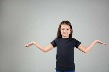 Emotional girl after making mistake on light background