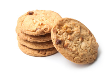 closeup of white chocolate cookies pile on white background