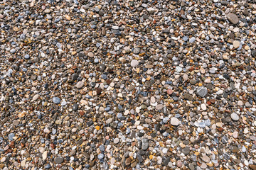 Natural abstract texture - different colorful pebbles background.
