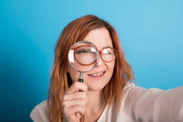 girl with manifying glass