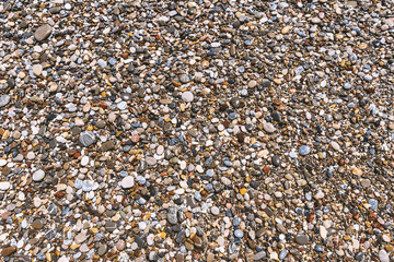 Natural abstract texture - different colorful pebbles background.
