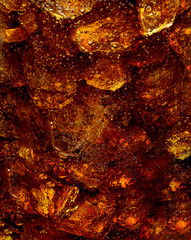 Cola with bubbles and crushed ice detail