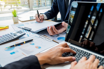 Business team meeting present. Professional investor working with new startup project. Digital tablet laptop computer design smart phone in office.