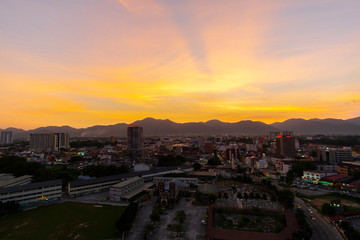 Aerial View of Ipoh CIty,Malaysia during sunset. soft focus,blur due to long exposure. visible noise due to high ISO.