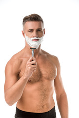adult man with foam on face shaving with razor isolated on white