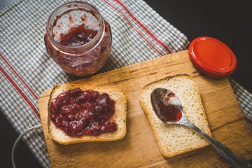 A pair of sandwiches on a cutting bord in cooking process