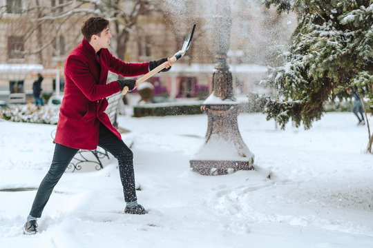 Young Man Shoveling Snow