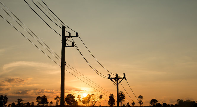 an old Power pole with line on Silhouette environment, High level of noise. sun rise or sun set time
