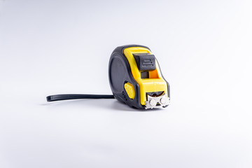 Fototapeta premium Measure Tape isolated on white background with selective focus and crop fragment