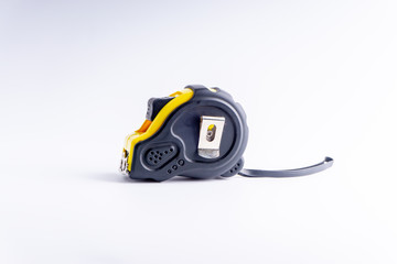 Fototapeta premium Measure Tape isolated on white background with selective focus and crop fragment