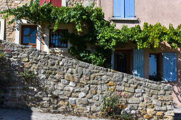 lane and house facade with vine, village Bédoins, Provence, France