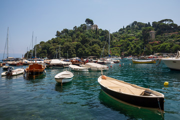 Fototapeta na wymiar View of boats in the beautiful harbour at Portofino, Italy