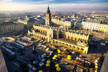 Obraz premium Aerial view from the tower of the church of St. Mary on Main Square in the Old Town and Cloth Hall (Sukiennice) in Krakow, Poland. 10-12-2015