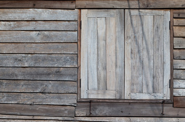 Old wooden window with wooden wall