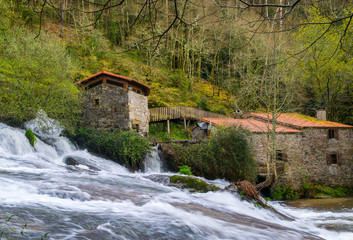 Waterfall and old water mills in galicia, Spain. Natural Park Barosa river