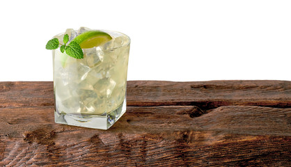 Vodka lime, gimlet or gin tonic with ice in glass on white background including clipping path