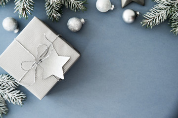 Christmas silver handmade gift boxes on blue background top view. Merry Christmas greeting card,...