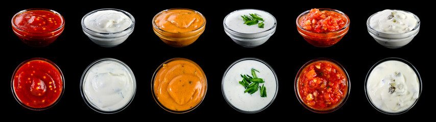 Bowl with sauce set isolated on black background