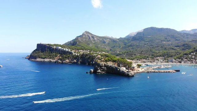 Flight over the bay of Port de Soller in Mallorca Tramuntana Mountains