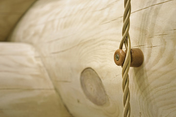 Wooden Swedish Cope profile log home wall with hinged wiring