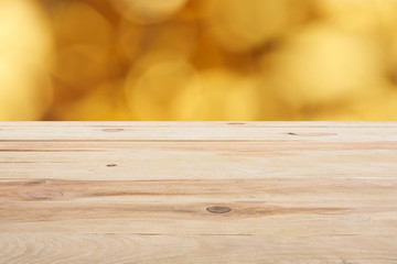 template of beige wooden floor on blurred golden background