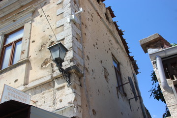 Exterior of destroyed building against clear sky