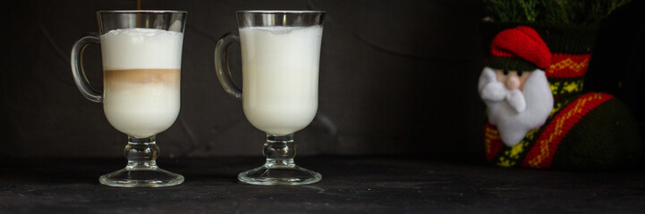 Latte - coffee with milk in a transparent cup on the table. Top view.