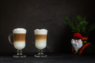 Latte - coffee with milk in a transparent cup on the table. Top view.