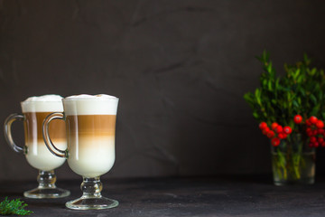 Latte - coffee with milk in a transparent cup on the table. Top view.