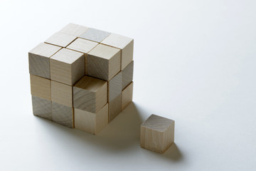 Last missing piece wood cube to complete a bigger block