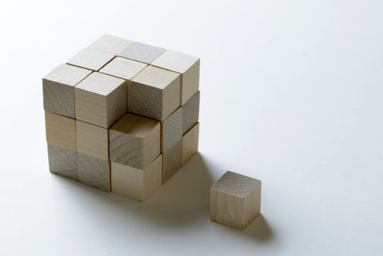 Last missing piece wood cube to complete a bigger block