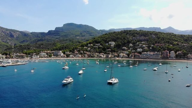 Flight over the bay of Port de Soller in Mallorca Tramuntana Mountains