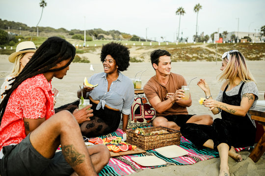 Friends Having A Picnic At The Beach