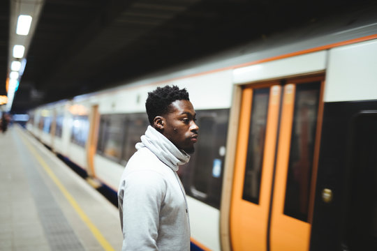 Man Waiting For The Train Doors To Open