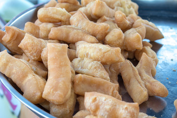 Closeup of deep fried dough stick in market