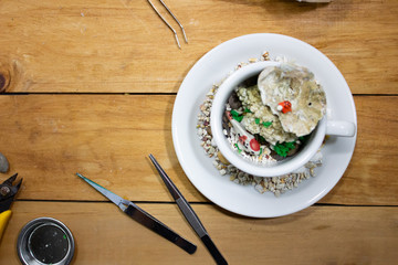 Crafting decoration hobby workshop with tools on wooden table.