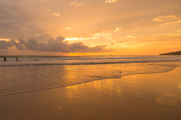 Fototapeta na wymiar Golden sunset on the beach 