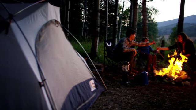 American Caucasian family camping and enjoying holiday adventure together