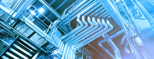 Obraz premium Equipment, cables and piping as found inside of a modern industrial power plant