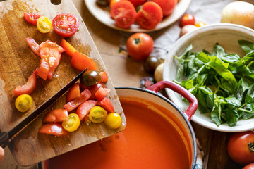 Homemade tomato soup cooking in a kitchen