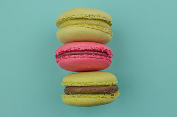 French macaroon cake. Macaroons in box with dried flowers on wood background