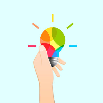Hand holding colorful light bulb as creativity and idea concept