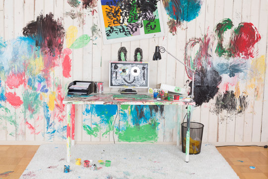 Office painted with colorful finger paint