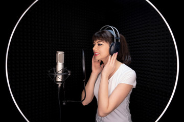 Beauty Young Dubbing Artist Girl In Recording Studio Talking Into Microphone - obrazy, fototapety, plakaty