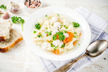 Healthy food, diet lunch. Soup with meatballs, fresh vegetables and greens.