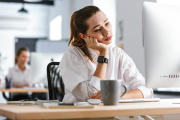 Bored young woman dressed in shirt