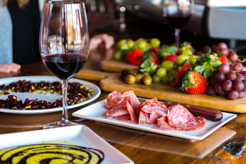 Spread of italian meat fruit and wine