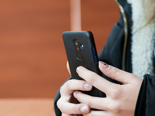 Woman uses smartphone in office
