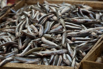 natural texture of small salted marine fish in a heap in a box